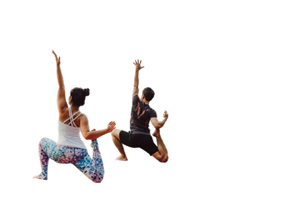Two people practicing yoga in high lunge pose with arms raised.
